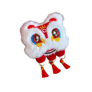 Plush Lunar New Year lion dance hair clip with festive red tassels decoration