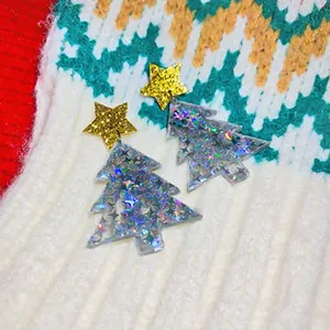 Festive Christmas tree drop earrings featuring holographic glitter and golden star studs