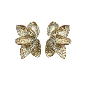 Elegant gold-finished textured flower petal stud earrings with silver needles for women