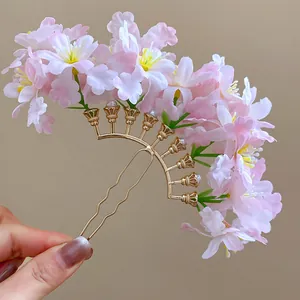 Exquisite detail of sweet pink fabric floral hair fork with golden metal u-shaped pin