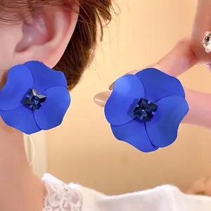 Elegant matte blue flower stud earrings with a square rhinestone center in a vintage style
