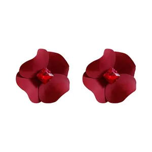 Vintage style red lacquer flower stud earrings featuring a brilliant red crystal center
