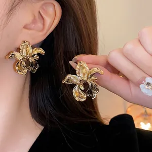 Statement gold irregular flower stud earrings with textured petals for women fashion