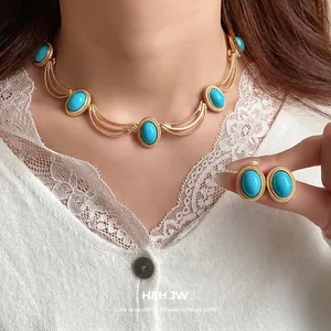 Elegant vintage style oval turquoise necklace and earring set in gold-tone metal finish