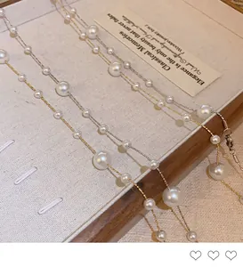 Close-up of elegant irregular pearl layered necklace in French vintage style