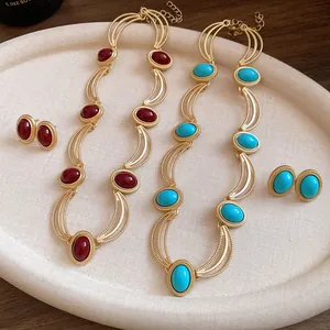 Detailed view of vintage palace style jewelry sets featuring red and turquoise oval stones