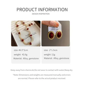 Vintage style gold-tone necklace and earrings with deep red oval gemstones detail info
