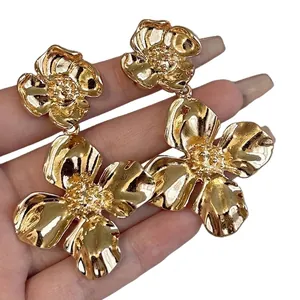 Elegant large gold flower earrings with textured metal finish French style jewelry
