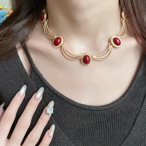 Close-up detail of vintage oval red gemstone necklace in elegant court style for women