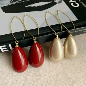 Elegant French vintage waterdrop earrings in red and champagne pearl with gold hooks