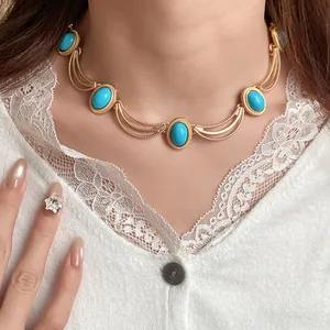 Vintage gold-tone court style choker featuring elegant oval turquoise stone embellishments