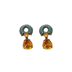 Vintage geometric teardrop earrings with teal rhinestones and faceted orange gems
