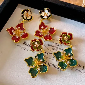 French vintage enamel flower stud earrings with rhinestones in red and green colors