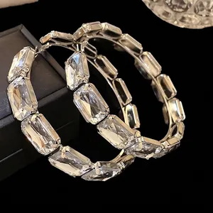 Exaggerated rectangular crystal encrusted hoop earrings in silver finish