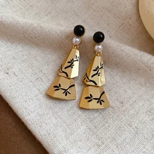 Elegant New Chinese vintage gold earrings with pearls and black branch pattern on fabric