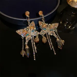 Elegant crystal butterfly tassel earrings in a vintage baroque design with golden finish