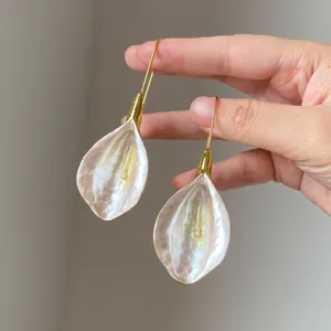 Elegant pearlescent petal drop earrings with gold hooks for women