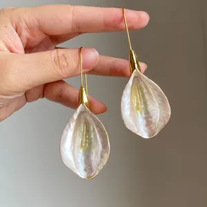 Vintage-style gold floral petal drop earrings with elegant pearlescent finish