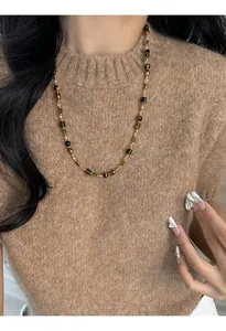 Detail of Tiger Eye brown beaded long necklace for autumn winter sweater accessory