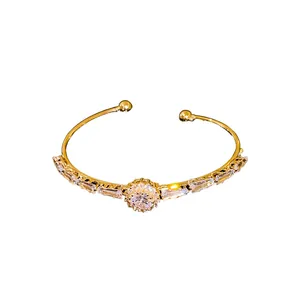 Luxury gold open bangle bracelet with sparkling double-row cubic zirconia stones