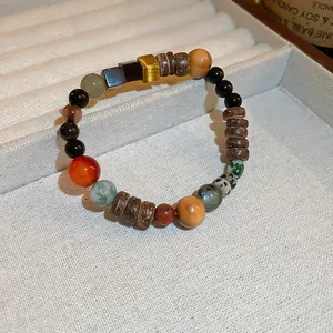 Handmade multi-gemstone beaded bracelet with natural wood and tiger eye accents.