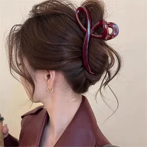 Elegant burgundy wave hair claw clip for chic back-of-head French twist hairstyle styling