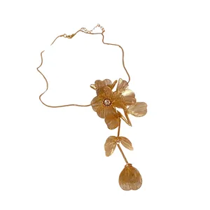 Elegant gold hollow flower bracelet with crystal accents, luxury statement jewelry piece.