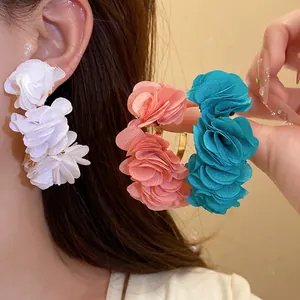 Handmade C-shaped earrings with colorful chiffon flower petals for a beach vacation look