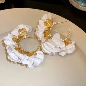 Elegant white chiffon flower C-shaped hoop earrings with golden leaf details