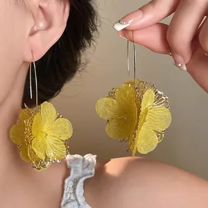 Elegant yellow hollow flower drop earrings with stylish dopamine aesthetic design