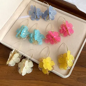 Retro colorful hollow-out floral drop earrings with gold-tone accents and fabric petals