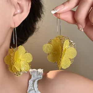 Elegant yellow lace flower drop earrings with intricate hollow gold rim for women