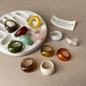 Assorted vintage resin geometric rings in vibrant colors and glossy textures
