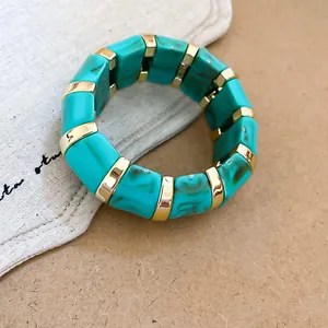 Bohemian turquoise marbled acrylic stretch bracelet with polished gold-tone metal spacers