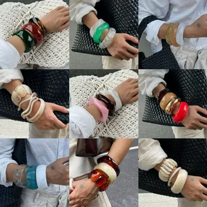 Various marbled and irregular wave acrylic bracelets shown in a 3x3 grid for high-end styling