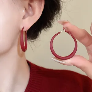 Matte red circular hoop earrings with minimalist geometric design for daily fashion wear