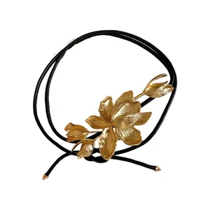 Vintage gold metal tulip waist chain with black leather cord for luxury fashion