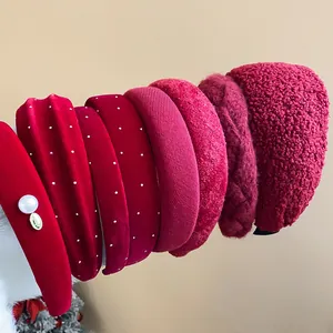 Assortment of red headbands in velvet, pearl, ribbed, and sherpa textures for winter.