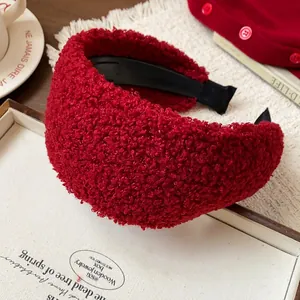 Close-up of red sherpa texture wide headband for high top hairstyle look