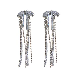 Elegant silver bow tassel earrings with sparkling zircon stones in a vintage style