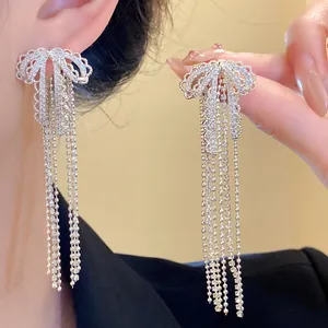 Detailed close-up view of elegant silver needle zircon bow tassel earrings for women