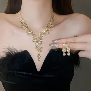 Vintage palace style necklace and earrings set with waterdrop rhinestones on model
