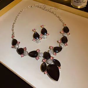 Detailed view of the vintage teardrop crystal necklace and earring jewelry set