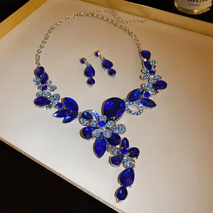 Elegant vintage style blue rhinestone teardrop floral necklace and earrings jewelry set.