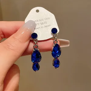 Elegant royal style blue teardrop faceted crystal dangle earrings with silver finish