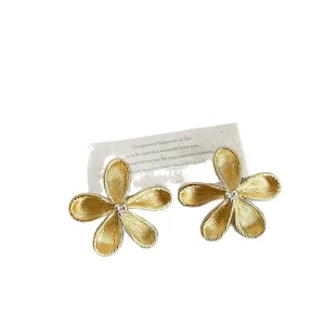 Elegant French minimalist gold flower stud earrings with S925 silver needles for women