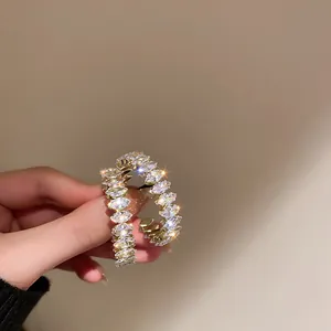 Stunning gold hoop earrings featuring sparkling marquise-cut cubic zirconia stones