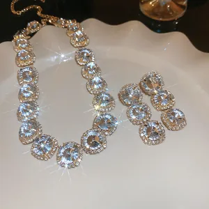 Detailed macro view of vintage rhinestone necklace and earrings with sparkling gems.