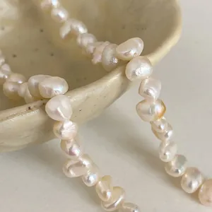Close-up macro view of high-quality irregular freshwater baroque pearls on a necklace