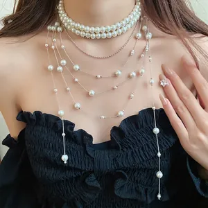 Elegant double-layer pearl beaded choker necklace with long silver tassel chains for women